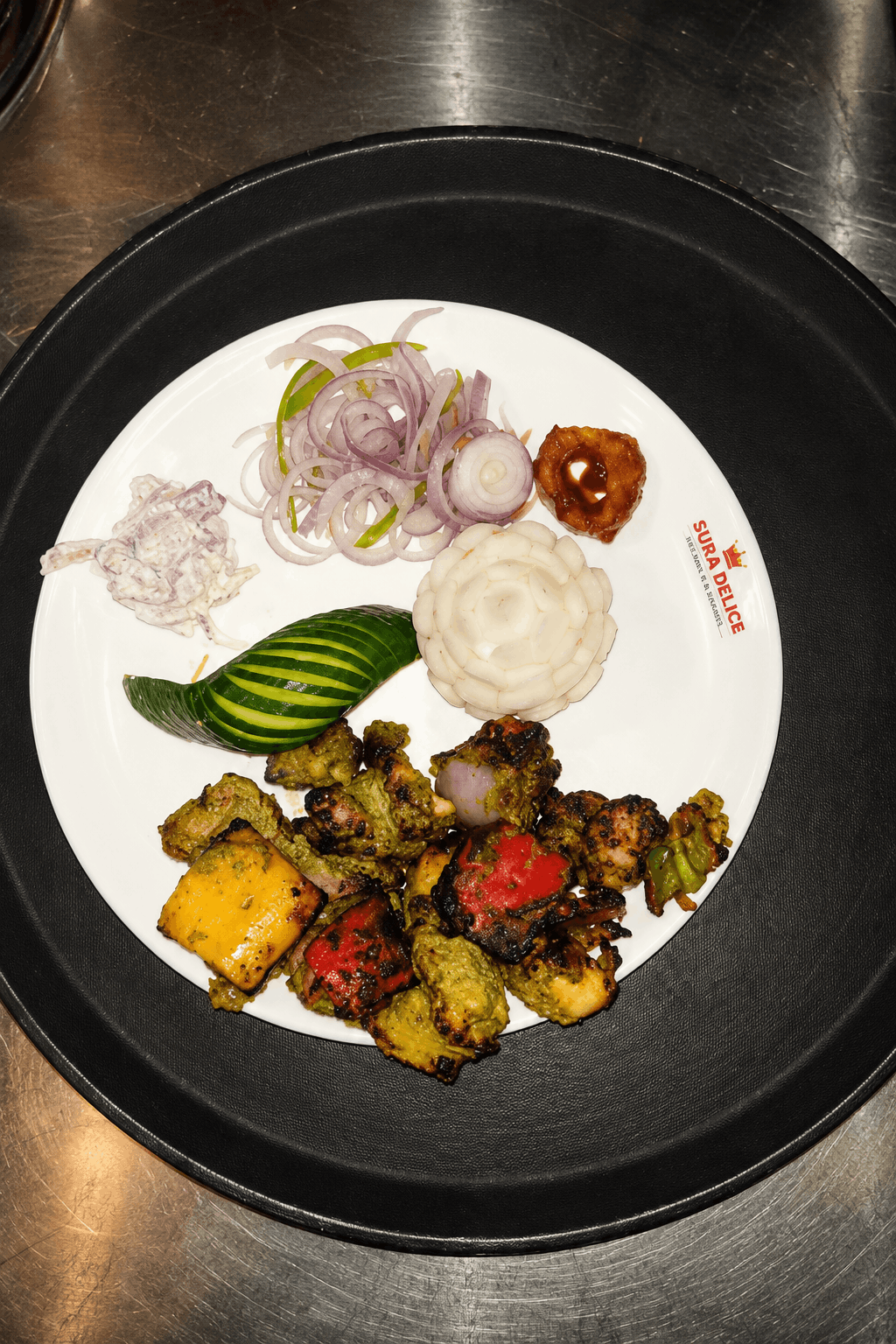 Sura Special Chicken Kebab platter with onions and chutney